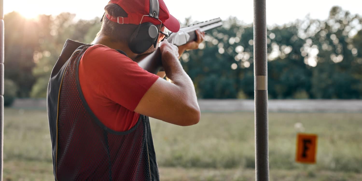 man shooting targets with an air rifle